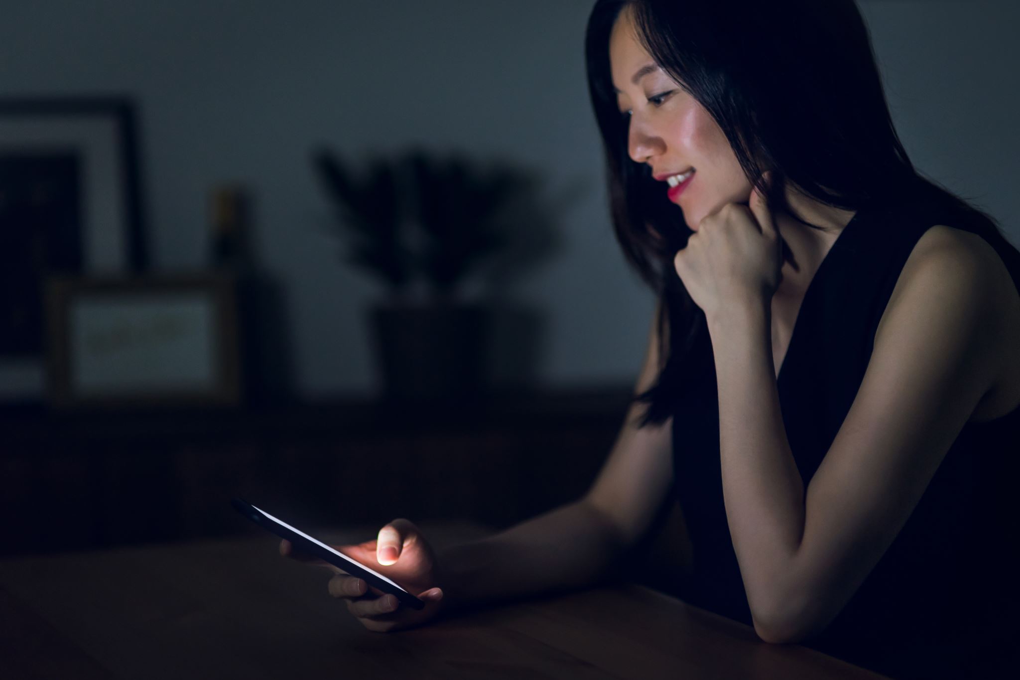 Woman-using-smartphone-at-home